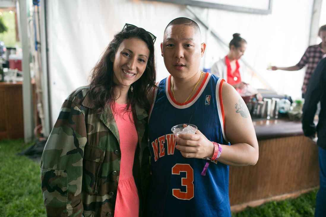 Chef Eddie Huang and a friend enjoy the spoils of the VIP tent<br/>